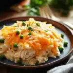 Close-up of a chicken rice casserole with creamy sauce and herbs