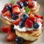 Close-up of golden brown pancake poppers with syrup drizzled on top, perfect for an easy breakfast.