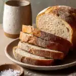 Close-up of freshly baked bread with a golden crust made from bread flour.