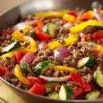 Close-up of a ground beef dish with vibrant colors and minimal background, gluten free.