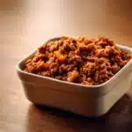 Close-up of a hearty ground beef dish with rich textures and warm lighting.