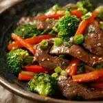 Close-up of a savory beef dish with rich textures and vibrant colors, perfect for a high protein dinner.