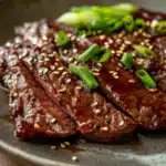 Close-up of high protein Korean BBQ beef with a clean background.