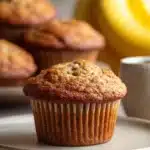 Close-up of Kodiak Cakes banana muffin with a golden brown top and soft texture.