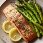 Close-up of Lemon Herb Butter Salmon and Asparagus with bright, natural lighting.