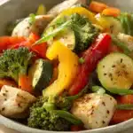 Close-up of a colorful low calorie chicken and vegetable dish with bright lighting