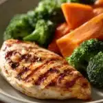 Close-up of a delicious low calorie chicken meal with creamy sauce and herbs.