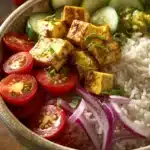 Close-up of a Middle Eastern Tofu Rice Bowl with vibrant vegetables and rice