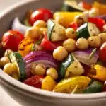 Close-up of roasted chickpeas and vegetables with bright natural lighting