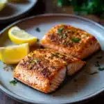 Close-up of salmon cooked in the Ninja air fryer with a clean background.