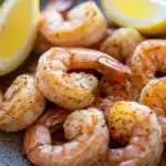 Close-up of air fryer frozen shrimp with a golden crispy texture