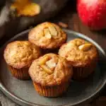Close-up of apple muffin with fresh apples on a clean background