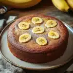 Close-up of a banana cake with a clean background, showcasing its texture and color.
