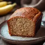 Close-up of a beautifully plated banana cake with a clean background