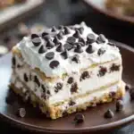 Close-up of chocolate chip cookie lasagna with layers of cookies and cream.
