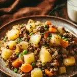 Close-up of a cozy ground beef dinner with rich textures and warm lighting