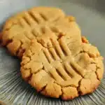 Close-up of freshly baked peanut butter cookies on a clean white background