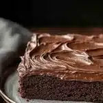 Close-up of a delicious sheet cake with a smooth frosting and decorative toppings.