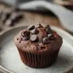 Close-up of double chocolate protein muffin tops by Joy Bauer with a clean background.