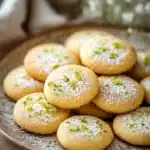 Close-up of key lime shortbread cookies on a white plate with a clean background.