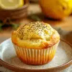 Close-up of lemon poppyseed muffin sourdough with a golden crust and poppy seeds.