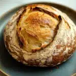 Close-up of a golden crust no knead bread with a rustic texture